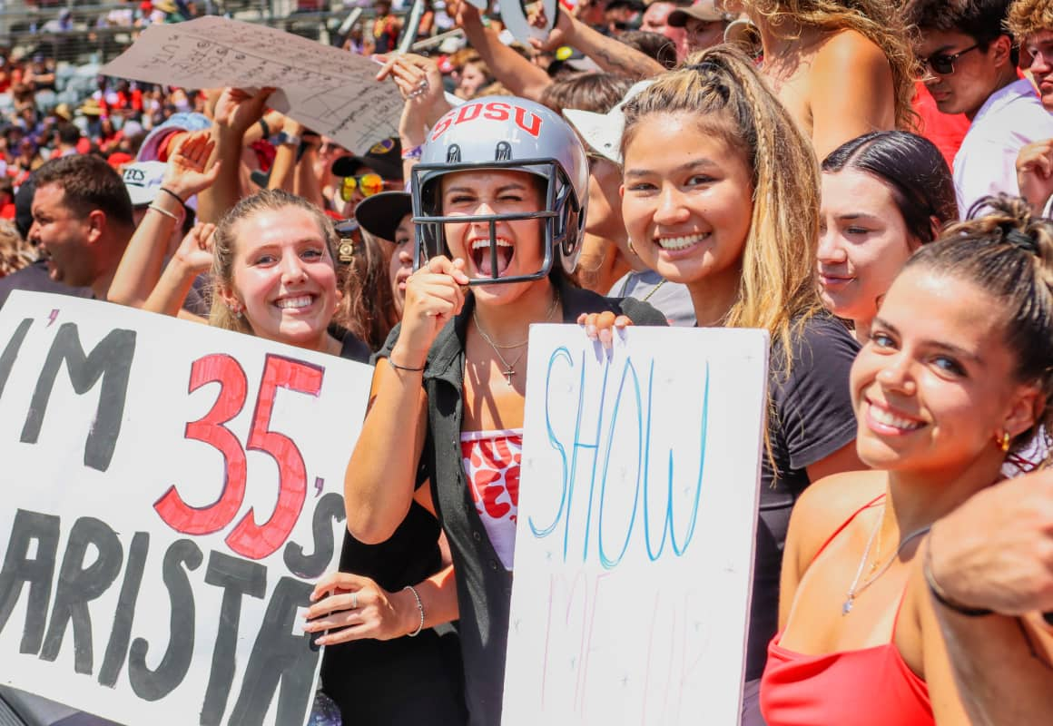 SDSU students cheering on the football team